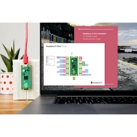 Laptop mit geöffneter Raspberry Pi Pico Pinout-Diagramm-Webseite auf dem Bildschirm. Daneben auf einer Platine montierter Raspberry Pi Pico.